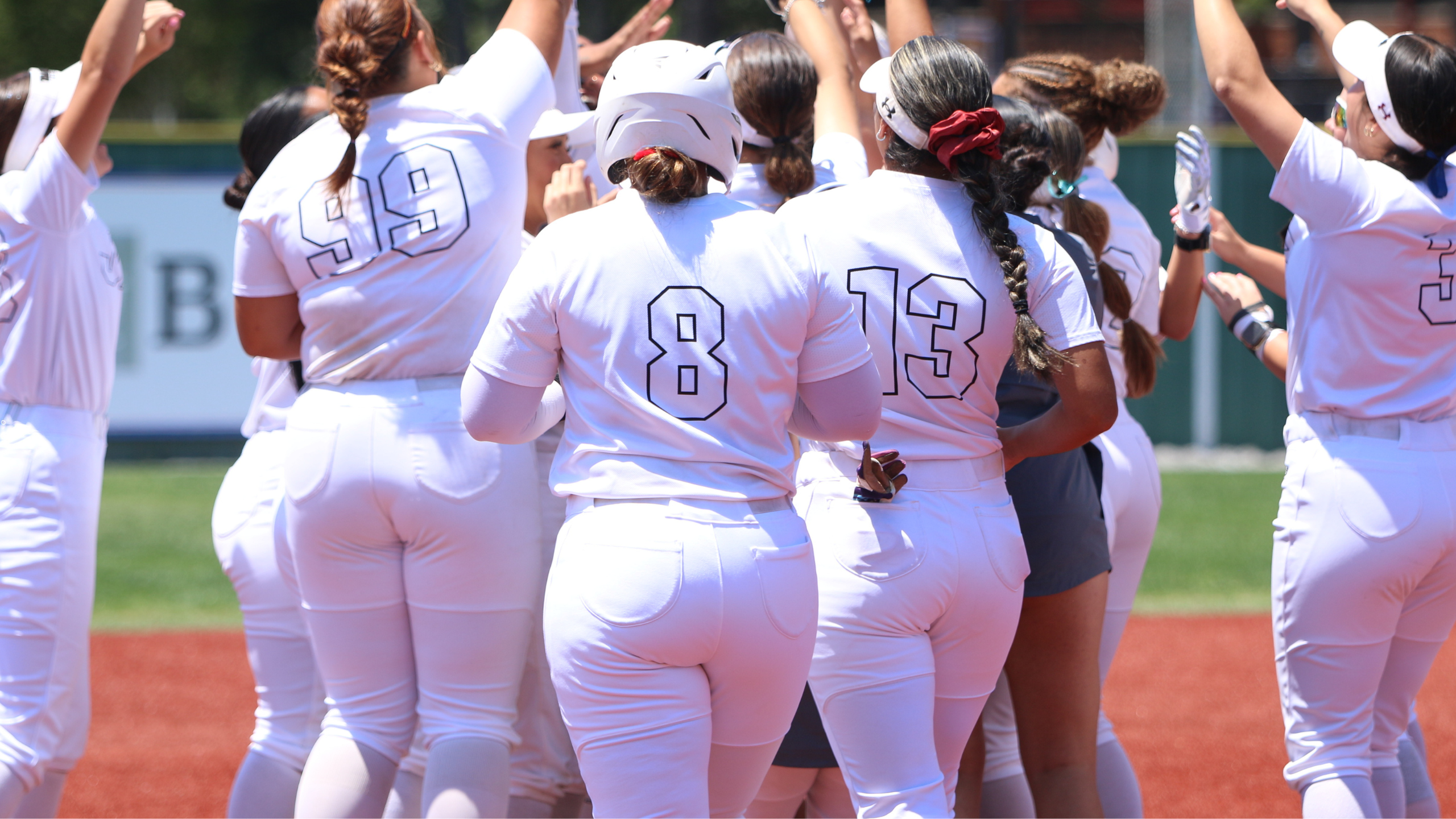 Jaguar softball players celebrate a victory at the RRAC tounrament
