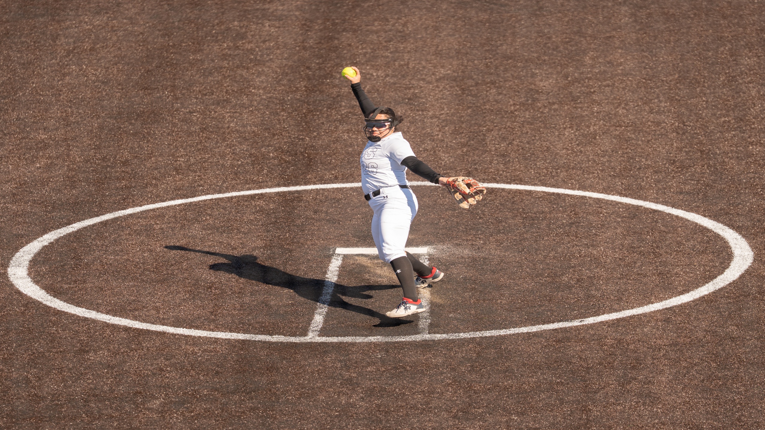 Sophomore pitcher Krisilyn Corral throws a pitch in Saturday's home opener. 