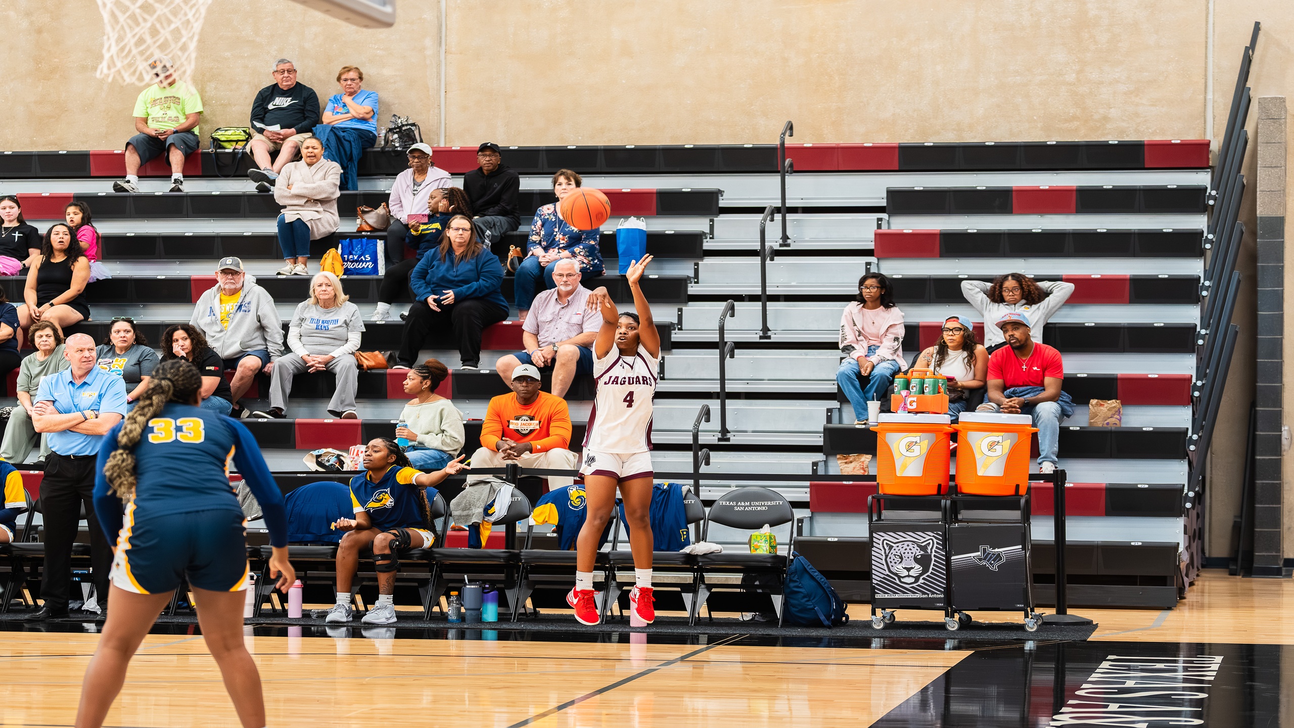 Jaguar's Sophomore TaMya Whitemon shoots a three-point shot in Thursday night's game. 